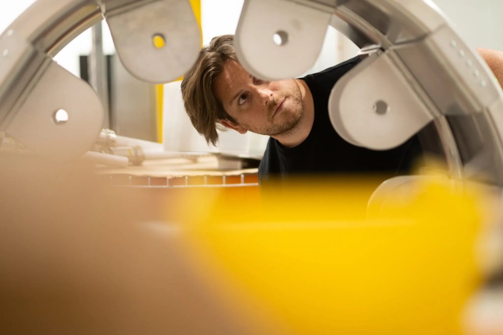 Pacific Fusion Power Plant engineer runs an inspection